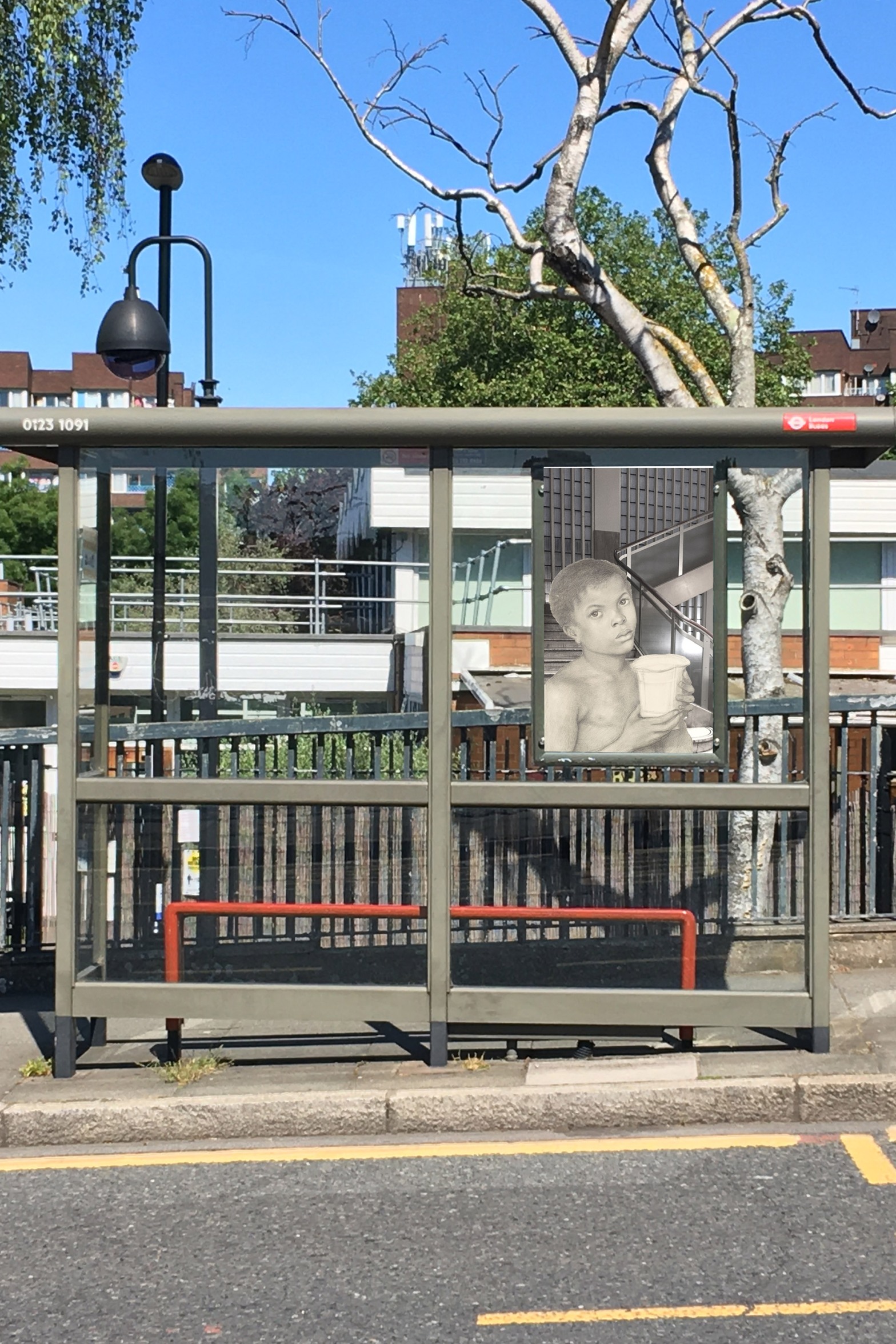 Dante Gabriel Rossetti's "The Beloved – Study of a Black Boy" (1865–66) in front of the stairway in the Piccadilly Waterstones (b&w) on the side of a bus stop on Oxestalls Road next to Deptford Park School, Deptford, London